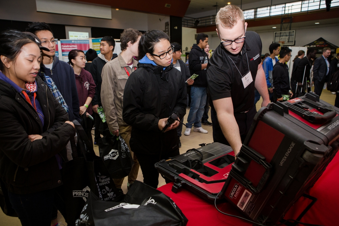 A man demonstrating a project to an audience